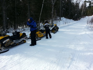 Snowmobiles Seen along a groomed trail